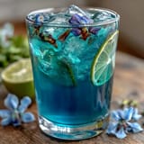 Refreshing color-changing butterfly pea lemonade with citrus infusion, perfect for summer parties.  