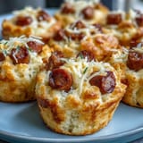 Savory baked mini corn dog muffins, a delightful appetizer with golden brown tops.
