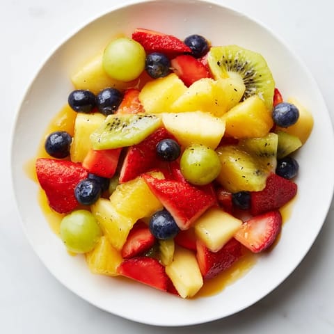 This colorful fruit salad features juicy pineapple and blueberries, perfect for a light, healthy dessert.