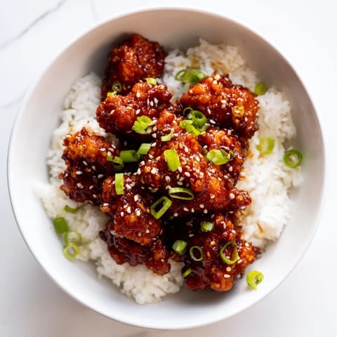 Crispy fried chicken, coated in a sweet and spicy sauce, is General Tso's Chicken perfection.