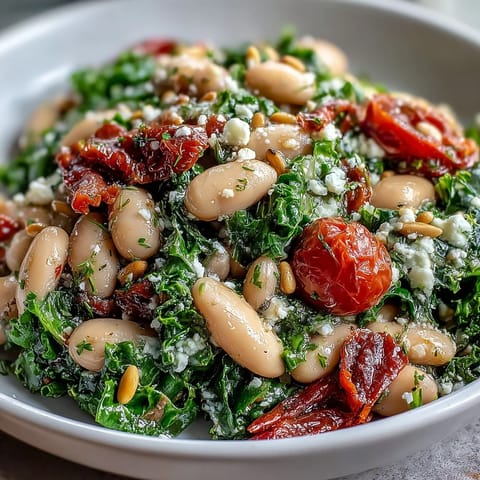 Vibrant White Bean and Kale Salad with bright lemon dressing, ready to enjoy.