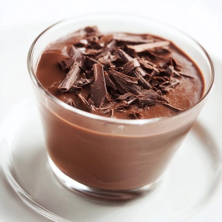 Homemade chocolate pudding, perfectly chilled, offering a luxurious and simple dessert recipe.