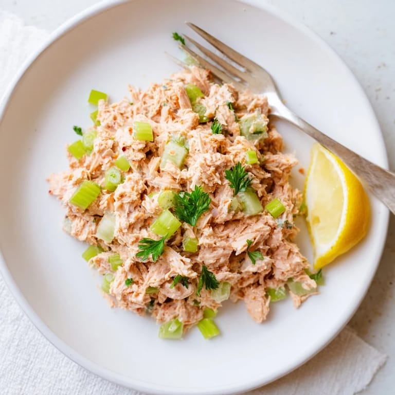 Healthy Spicy Zesty Tuna Salad in a lettuce cup, perfect for a light lunch or gluten-free wrap.